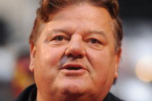 Robbie Coltrane. Crescimento e peso em vez de um cartão de visita